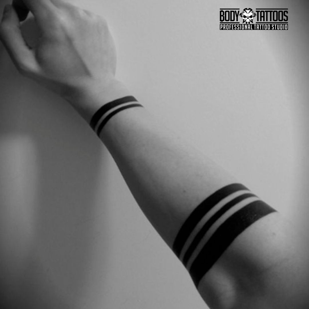 forearm band tattoo made in body tattoo studio kalyan