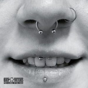 Septum piercing and lip piercing